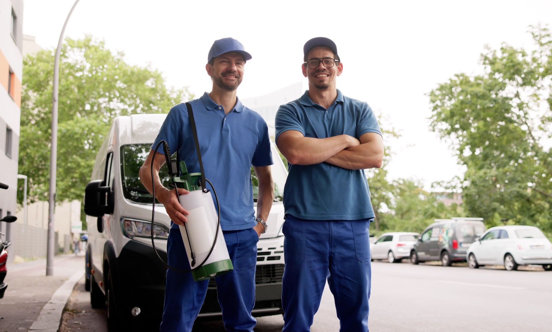 Smiling Exterminators In Van Providing Pest Control Services
